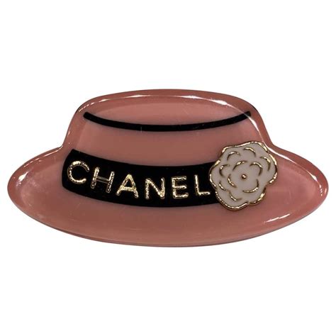 capa chanel|Chanel hats gold and silver.